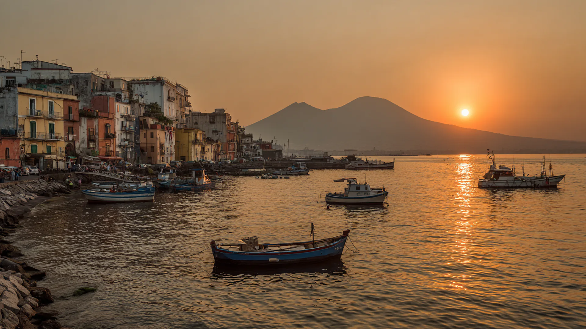 Naples bay at sunset with Vesuvius silhouette